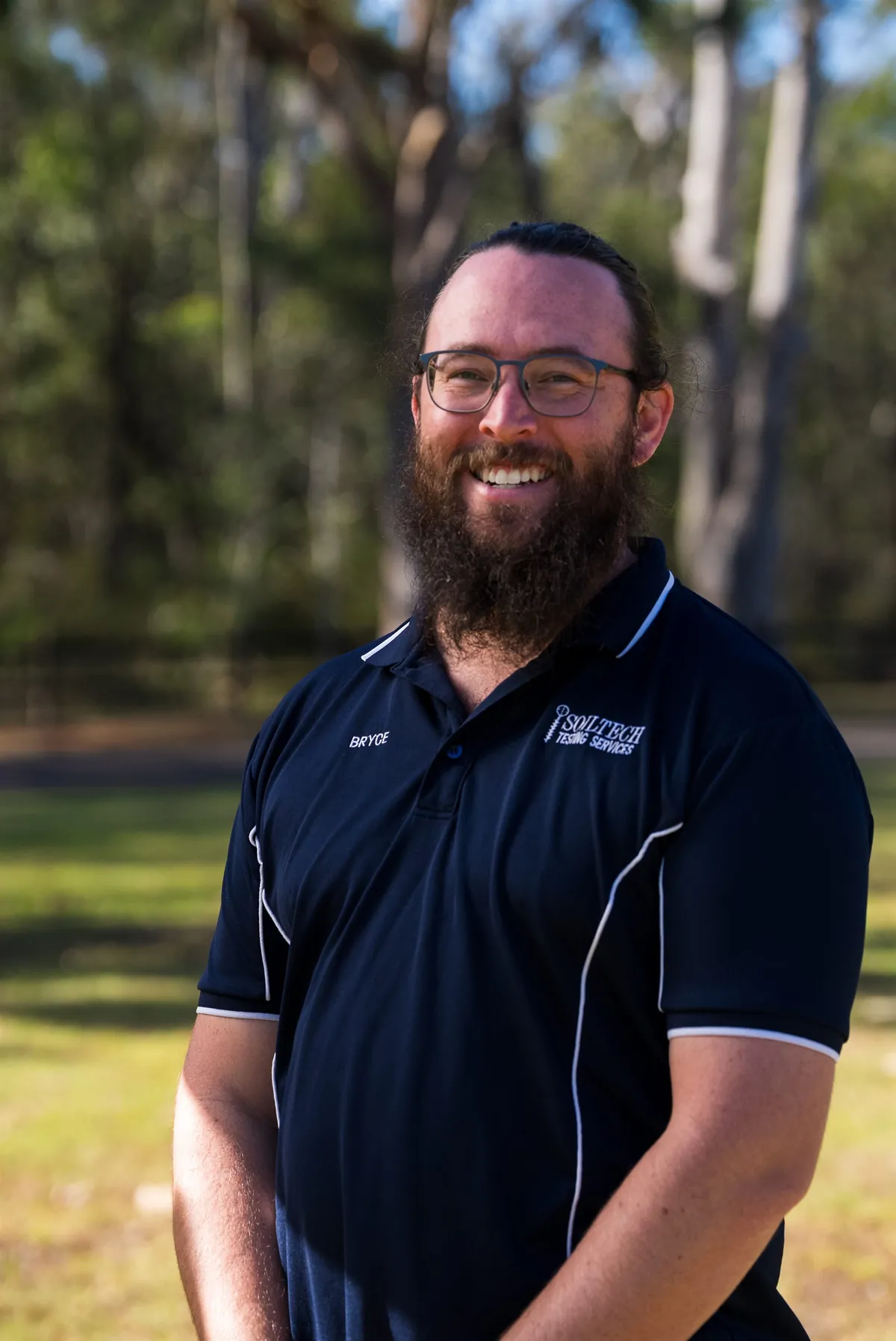 Bryce from Soiltech in an outdoor business headshot