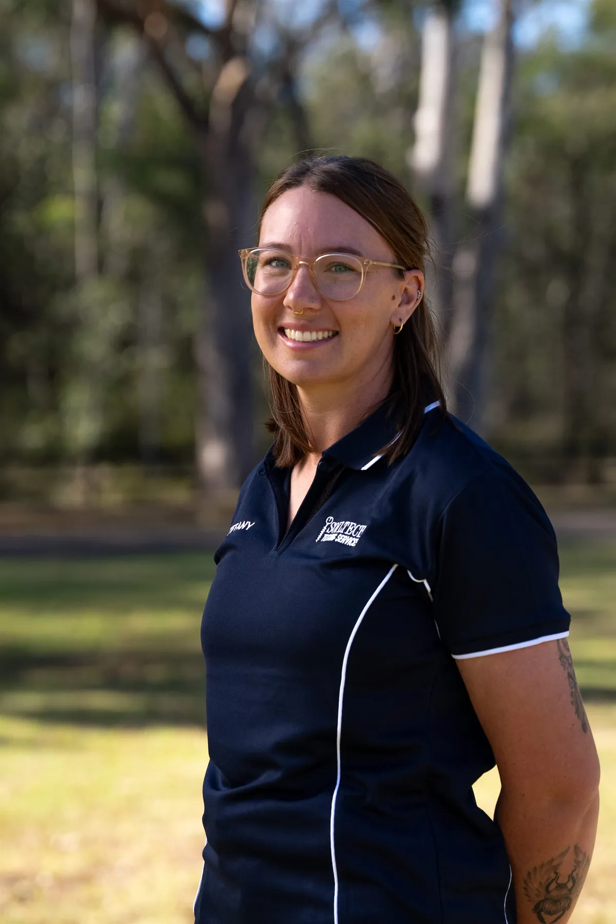 Soiltech team member photographed outdoors in branded workwear